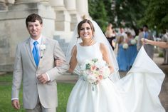 a bride and groom walking down the aisle after their wedding ceremony in washington, d c