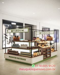 an image of a store display in the middle of a building with shelves full of products