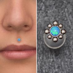 a woman's nose and nose ring with an opal stone in the middle