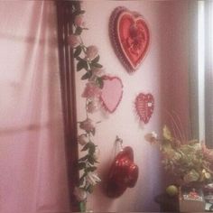 there are many heart shaped decorations on the wall