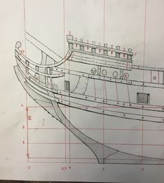 a drawing of a large boat on top of blueprints with measurements for the hull