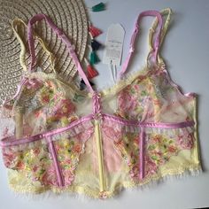 For Love And Lemons Floral Frenzy Bustier Pastel Yellow Small New Condition: New In Package Size: Small Color: Pastel Multi-Color This Fresh-As-A-Daisy Design Features Scalloped Lace Trim, Double Scrunchy Satin Straps, And A Crystal Flower Button Front And Center. Wear In Or Out. Wireless Unlined Double Adjustable Straps Back Hook And Eye Closures Scalloped Lace Trim Crystal Flower Buttons Tulle Ruffles Machine Wash Imported F2195a Pink Lace Trim Bra For Wedding, Pink Lace Trim Wedding Bra, Wedding Bra With Pink Lace Trim, Wedding Bra With Lace Trim In Pink, Pink Sheer Bra For Spring, Sheer Pink Bra For Spring, Spring Sheer Pink Bra, Sheer Party Bra For Spring, Sheer Bra For Party In Spring