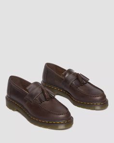 Be the envy of your friends with the cool Adrian Dark Brown Crazy Horse Tassel. Made from Crazy Horse leather - for a rugged, worn-in look - with a double tassel and kiltie fringe, this Docs loafer is stylish and ultra-durable. Plus, its legendary air-cushioned sole and signature yellow welt stitching make a statement wherever you go. Get your feet into some subcultural swagger! 8053 Quad, Brown Doc Martens, Fred Perry Amy Winehouse, Brown Dr Martens, Black Platform Shoes, Fur Accessories, Tripp Nyc, Tassel Loafers, Swag Shoes