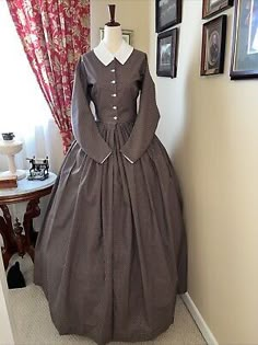 This dress is a size 12 and filts the lovely lady with Bust 34 and Waist 26.5. If we don't have the color / style or size you need, we do special orders! This dress is made from a period pattern - photo copies of the originals. 1860s Fashion Poor, Fitted Historical Style Dress For Fancy Dress, Fitted Long Sleeve Historical Dress, Cotton Long Sleeve Dresses With Historical Design, Long Sleeve Cotton Dress With Historical Design, Long Sleeve Cotton Dresses With Historical Design, Historical Design Fitted Cotton Dress, Victorian Style Costume Dress With Buttons, Victorian Costume Dress With Buttons