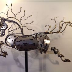 a metal sculpture that has been made to look like a horse