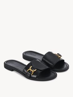 Chloé Marcie Slide | Chloé US Elegant Leather Mules With Rectangular Buckle, Luxury Calf Leather Slides With Buckle Closure, Elegant Leather Slides With Buckle Closure, Leather Slide Mules With Tang Buckle, Classic Leather Sandals With Rectangular Buckle, Designer Leather Sandals With Gold Buckle, Formal Leather Sandals With Gold Buckle, Luxury Leather Slides With Tang Buckle, Luxury Leather Sandals With Gold Buckle