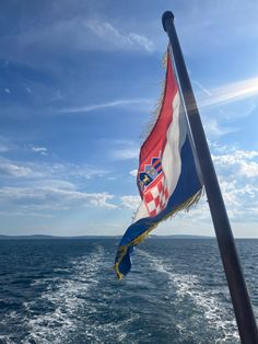 Croatian flag blowing in the wind over the blue ocean Croatian Flag Aesthetic, Croatian Summer Aesthetic, Croatia Flag Aesthetic, Lara Core, Croatia Culture Aesthetic, Croatia Sea Aesthetic, Balkan Aesthetic, Slovenia Flag, Croatia Aesthetic