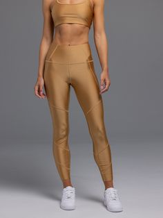 Designed to provide maximum comfort and support, the Divina Legging is constructed with a fabric blend of nylon and elastane sourced from Italy. Perfect for a relaxing yoga class and to get you through a long-distance run, this high-waisted, full-length legging features a satin-like feel that defines and sculpts. Finished with a hidden back pocket on the waistband and the reflective Greyson wolf for an elevated touch. 79% Nylon | 21% Spandex Made in Italy Lycra Leggings, Long Distance Running, Relaxing Yoga, Yoga Class, Long Distance, Women's Leggings, Two Piece Pant Set, Leather Pants, Fitness Models