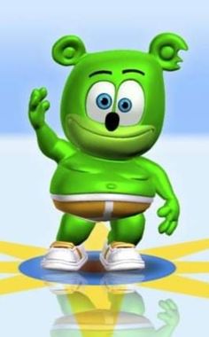 a green cartoon character standing on top of a blue and yellow floor with his hands in the air