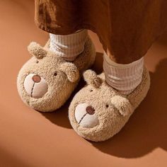 Nothing beats slipping your feet into a warm pair of slippers on a chilly winter morning. With cute cartoon bear design slippers, your girls are sure to find their new favorite creature comforts. It is crafted from soft fabric and flexible insoles; these adorable bear kid slippers prioritise comfort before all else. So get ready for bedtime with the help of some fluffy characters when you slip into these bear slippers. Upper Material: Fur Lining Material: Suede Kids Bunny Slippers, Fluffy Bunny Slippers, Kid Slippers, Elephant Slippers, Trendy Slippers, Shark Slippers, Cute Cartoon Bear, Bear Slippers, Bunny Slippers