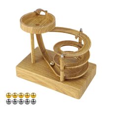 a wooden object with four balls around it