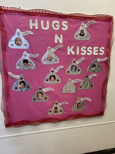 a pink bulletin board with pictures and words on it that says hugs n kissess