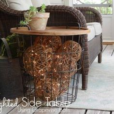 a table with some lights in it on top of a wooden floor next to a wicker chair