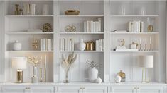 a white bookcase filled with lots of books next to a lamp and vases