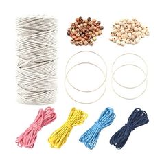 various types of string and beads on a white background