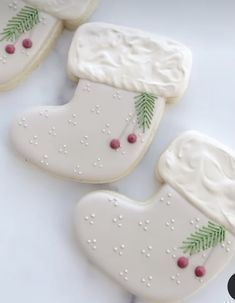 three decorated cookies sitting on top of each other