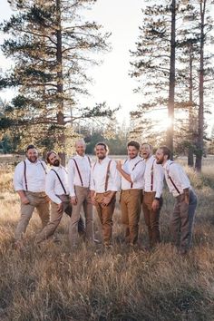 a group of men standing next to each other in a field