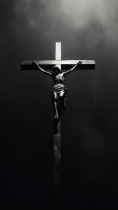 a black and white photo of a crucifix