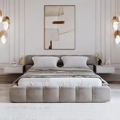 a large bed sitting in the middle of a room with two lamps on either side of it