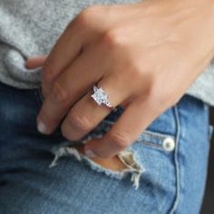 a close up of a person wearing a ring