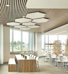 an empty conference room with tables and chairs