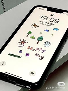 an iphone with stickers on the screen