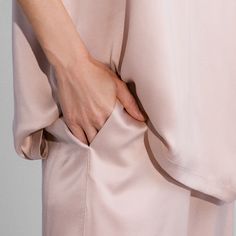 We've combined two of our favorites for the perfect, polished lounge 'fit. The full-coverage, oversized top features a pocket and a high-low hem, while the pant has side slits for ease of movement and ventilation. Adulting has never felt (or looked) this good. Silk Tee, Sleep Set, Hand Chain, Oversized Top, Pant Set, High Low Hem, American Vintage, Women's Intimates, High & Low