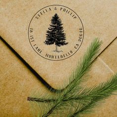 an envelope with a pine tree stamp on it