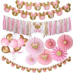 a pink and gold minnie mouse 1st birthday party decoration kit with balloons, streamers, paper fans, tissue pom poms