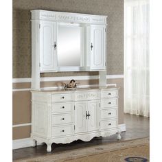 a white bathroom vanity with mirror and cabinet