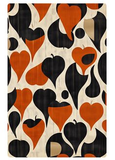 an orange, black and white pattern with hearts on it