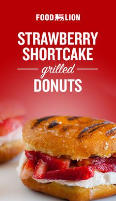 strawberry shortcake grilled donuts with cream cheese and strawberries on top, in front of a red background