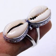 Weight of ring 7 Gm, 100% Made with high quality genuine natural money Cowrie Sea Shell Ring Dimensions Stone With Silver (Length 35 Millimeter) Stone With Silver (width 12 Millimeter) Stamped: 925 i make jewelry for a very special kind of Women's men's ,This stunning is handcrafted by one of our talented artisans. It is set in precious Fine Jewelry 925 Sterling Silver Jewelry, Polished to a brilliant luster> Cowrie shells meaning Cowrie shells are known as the most successful and the best form Handmade Open Ring Jewelry For Beach, Bohemian Style Toe Ring Jewelry For Gifts, Bohemian Midi Rings Nickel-free For Jewelry Making, Nickel Free Bohemian Ring, Adjustable Bohemian Crystal Ring Stamped 925, Nickel-free Bohemian Ring Jewelry, Silver Bohemian Stackable Jewelry, Nickel-free Bohemian Ring, Nickel-free Bohemian Style Ring