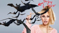 a woman is surrounded by bats flying in the air with her finger pointing at it