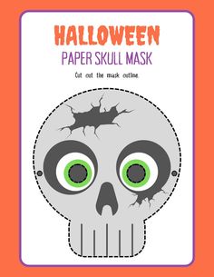 a paper skull mask with green eyes