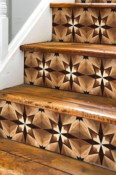 some wooden steps with decorative tiles on them