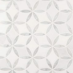 a white and grey tile with circles on it