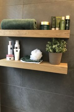 the shelves in the bathroom are filled with personal care items