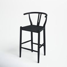 a black wooden chair on a white background with the seat up and back turned down