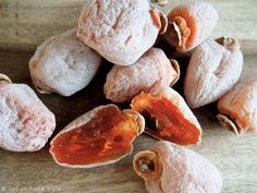 some powdered sugar covered pastries on a wooden table