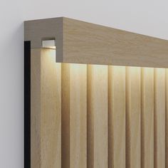 the light shines brightly through the wooden slats on this wall mounted headboard