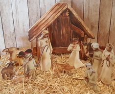 a nativity scene with figurines of the birth of jesus