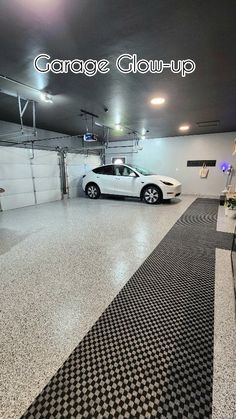 a white car parked in a garage next to a black and white checkered floor