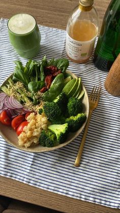 a plate with broccoli, cauliflower, tomatoes and other vegetables on it