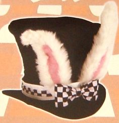 a black hat with white rabbit ears and a checkered bow tie