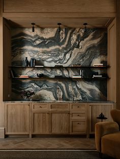 a living room with wooden shelves and marbled walls