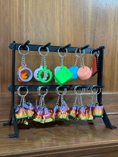 an assortment of key chains hanging from a rack