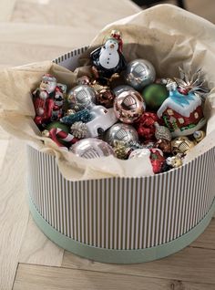 an open tin can filled with christmas ornaments