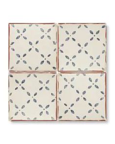 four square tiles with leaves on them