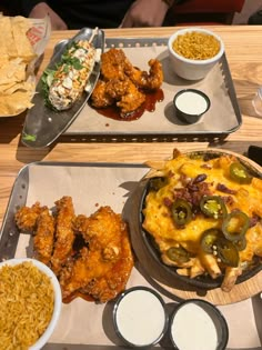 two trays filled with different types of food